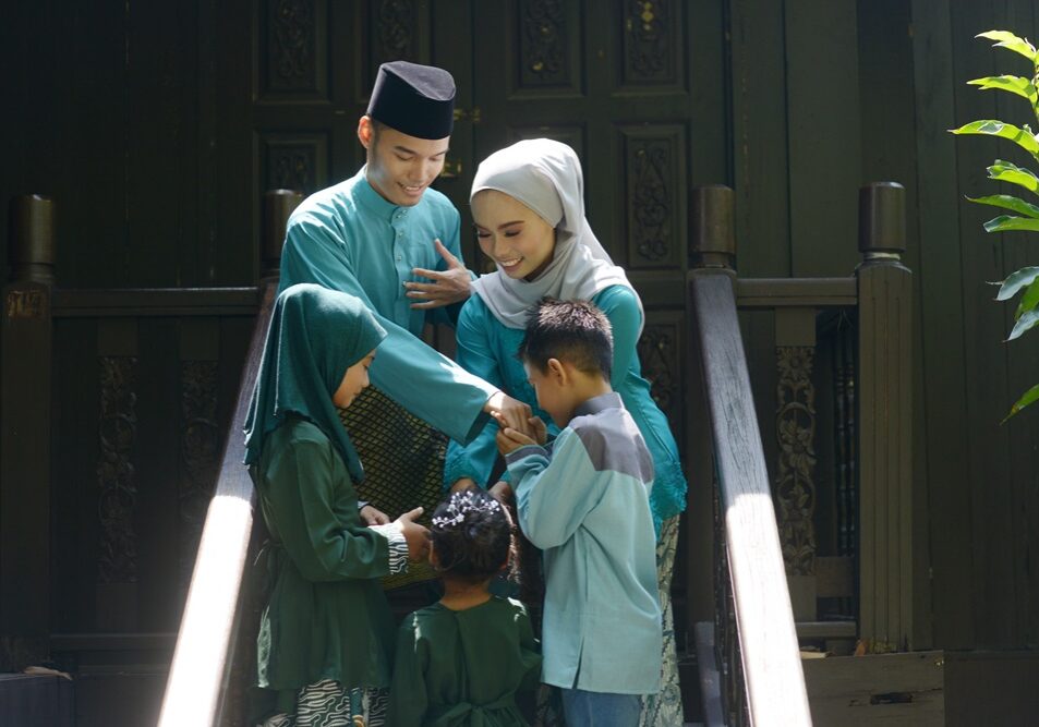 Muslim family greeting, Hari Raya Eid Al-Fitr concept.